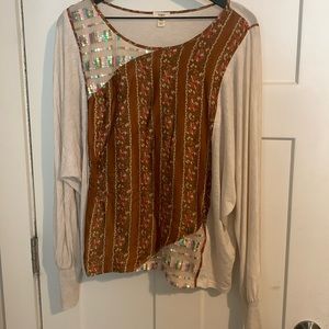 tiny long sleeve shirt with sequins and patterned patch